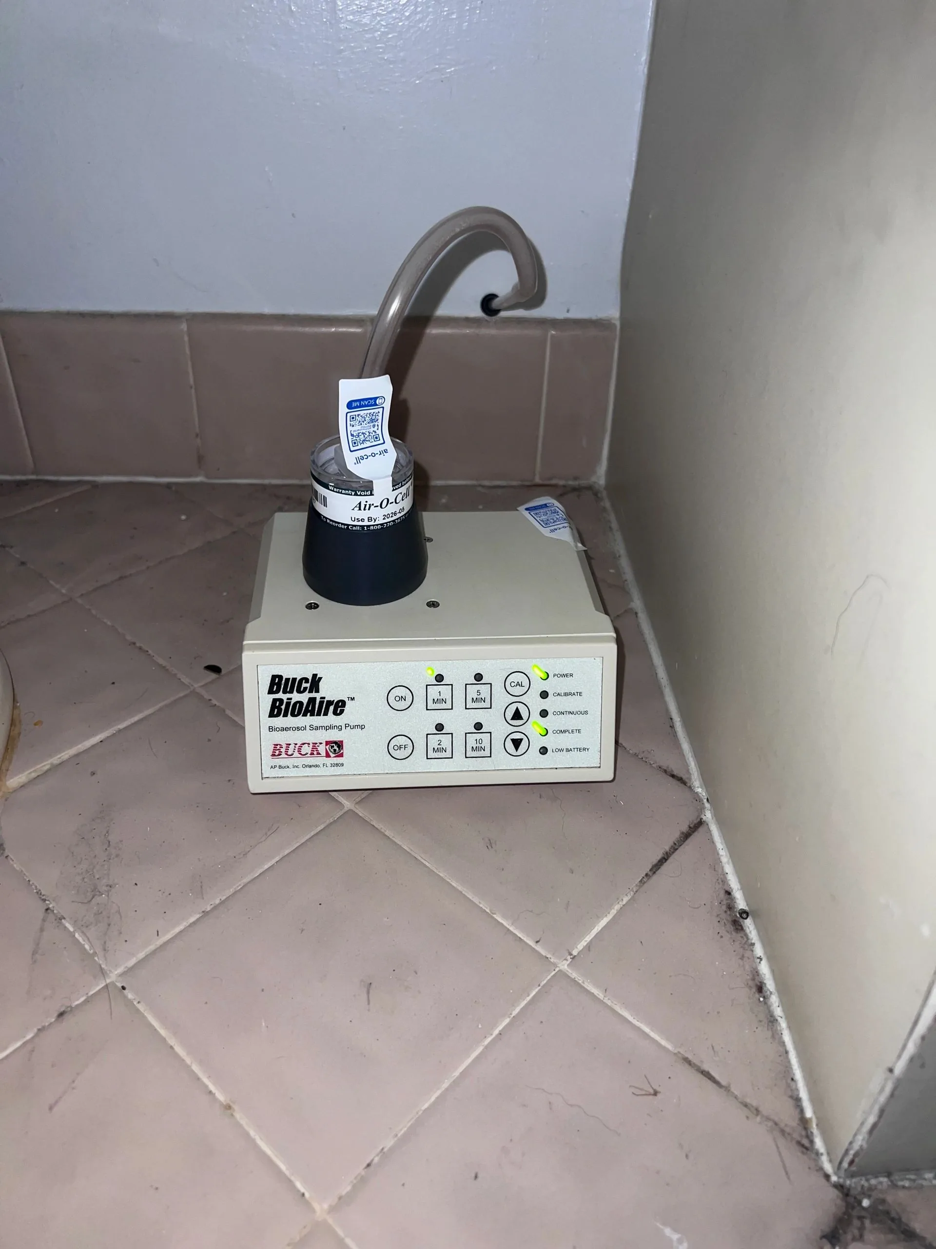Moisture meter checking wall moisture levels